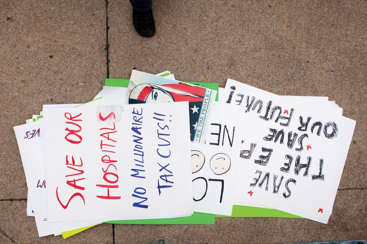 Protestors' signs piled on the Mount Vernon sidewalk