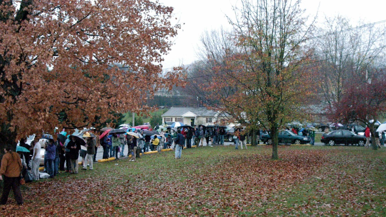 People wait in line to vote in 2004