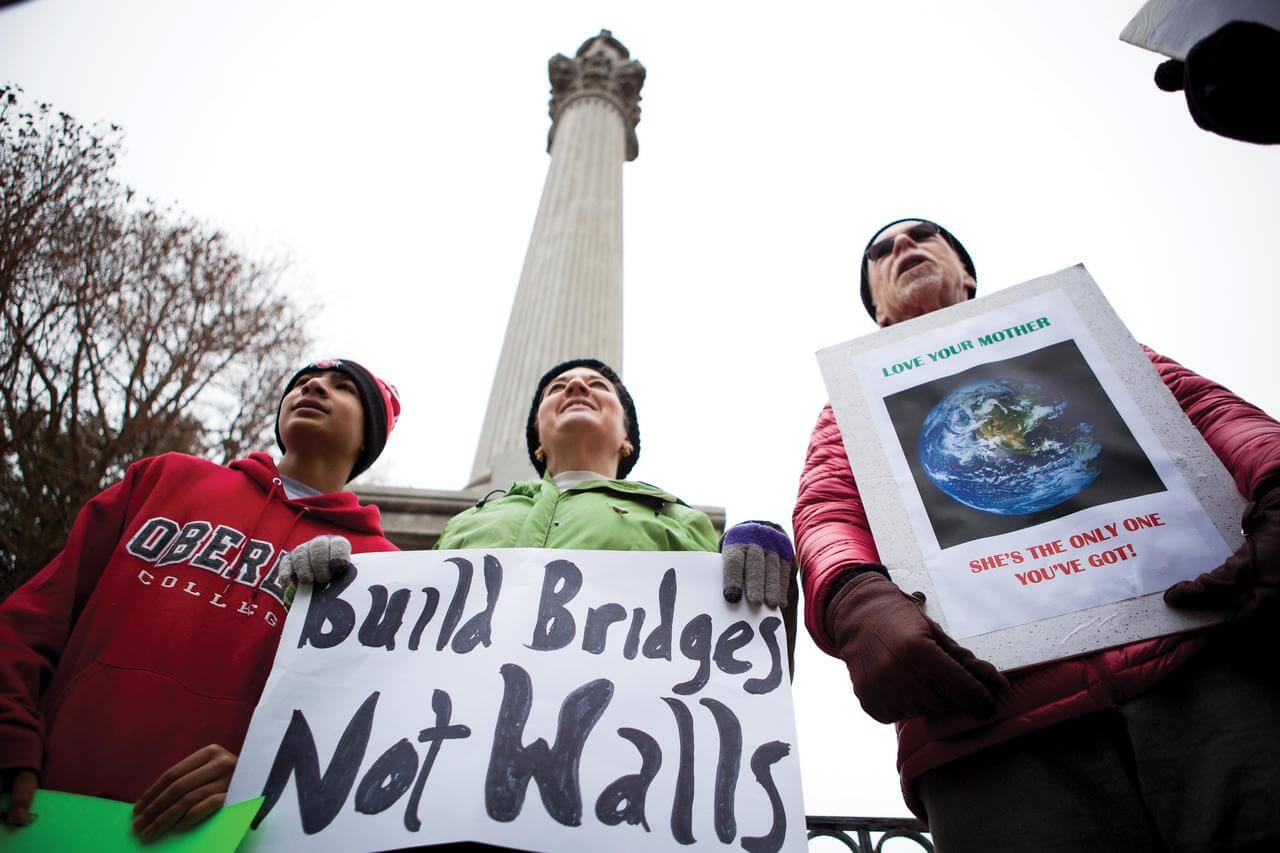 Protestors hold signs in the Mount Vernon town square